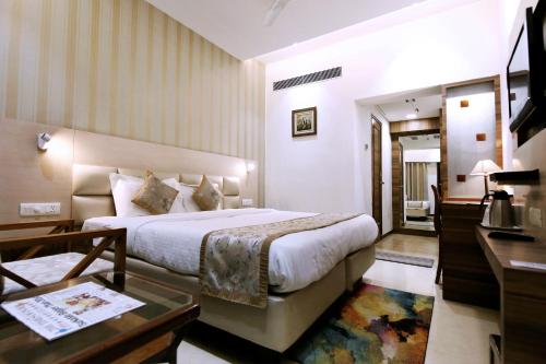 Ένα ή περισσότερα κρεβάτια σε δωμάτιο στο Hotel Yatrik