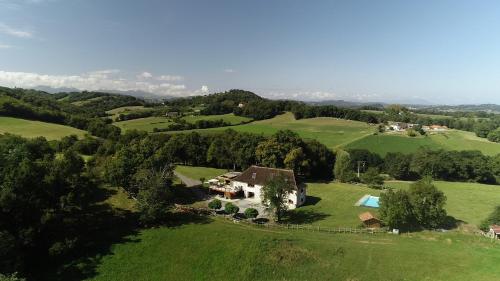 an aerial view of a house in a green field at Chambres d hotes AZKENA in Arrast-Larrebieu