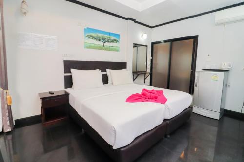 Кровать или кровати в номере Sinsamut Koh Samed