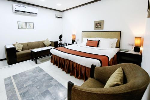 Ένα ή περισσότερα κρεβάτια σε δωμάτιο στο Hotel Yatrik