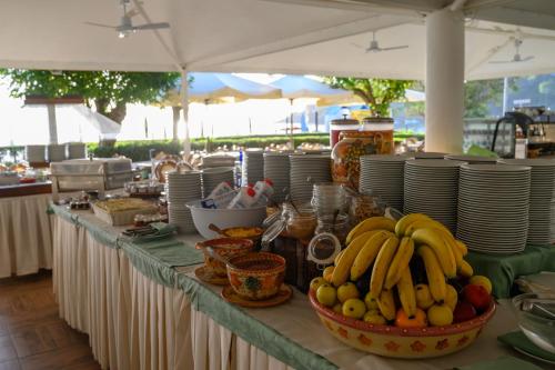 a table with a bunch of bananas and other fruits on it at Residence Le Acacie in Capoliveri