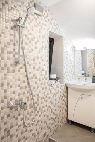 a bathroom with a shower and a sink at The Red Roof House in Plovdiv