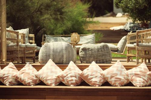 a row of pillows sitting on top of a table at ICON Valparaiso - Adults Only in Cala Murada