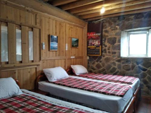 מיטה או מיטות בחדר ב-Chin -Be Village Cafe & Homestay