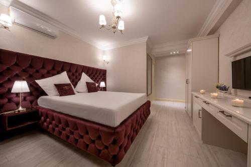 Ένα ή περισσότερα κρεβάτια σε δωμάτιο στο Hotel Casa Fiori