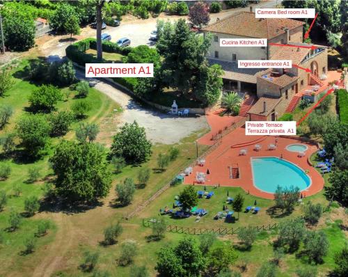 an aerial view of a resort with a swimming pool at Hotel Residence Villa Rioddi in Volterra