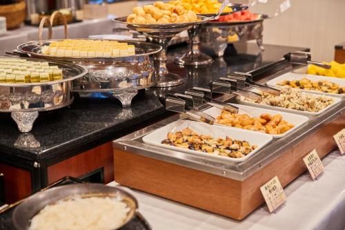 a buffet line with many different types of food at Myogi Green Hotel in Tomioka