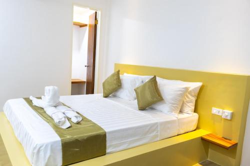 a hotel room with a bed with towels on it at Montecarlo Villas Panglao in Panglao