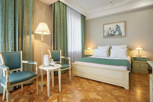 Кровать или кровати в номере Гостиница Белгород