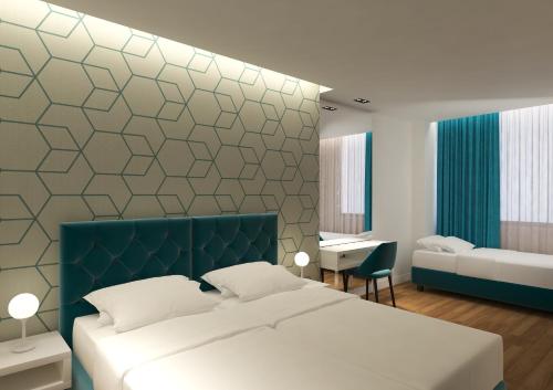 Tempat tidur dalam kamar di Athenian Montaza Hotel