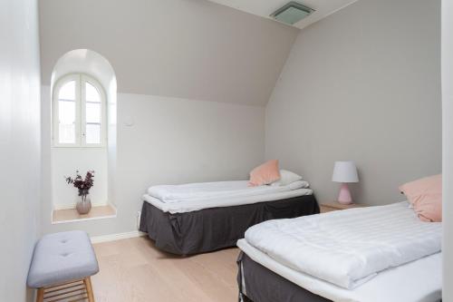 En eller flere senge i et værelse på 2ndhomes Luxury Helsinki City 2BR Penthouse w/Sauna