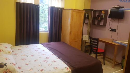 Postel nebo postele na pokoji v ubytování Abhi's homestay