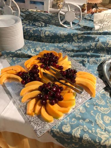 a bunch of bananas and grapes on a table at Hotel River in Civitella Roveto