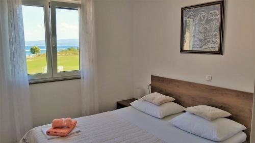 Postel nebo postele na pokoji v ubytování Apartment Ribnjak 10