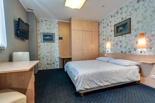 Cama o camas de una habitación en Marta Studios & Rooms