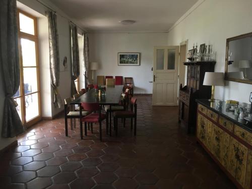 a living room with a dining room table and chairs at Villa Berging in Neulengbach