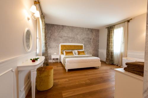 Кровать или кровати в номере Relais Althea Azienda Agrituristica