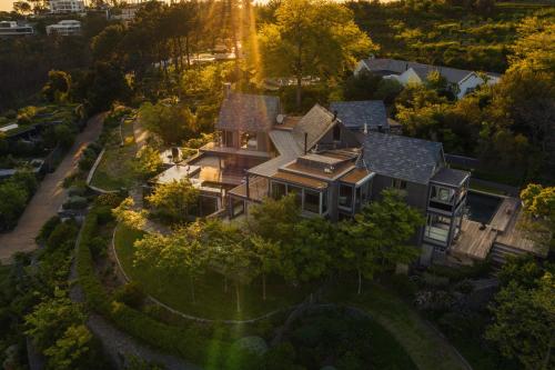 an aerial view of a large house at Spanish Farm Guest Lodge by Raw Africa Collection in Somerset West