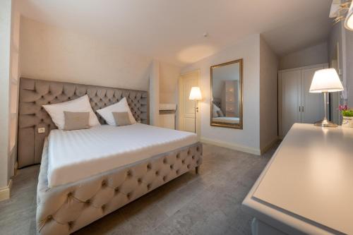 Ένα ή περισσότερα κρεβάτια σε δωμάτιο στο Hotel Casa Fiori