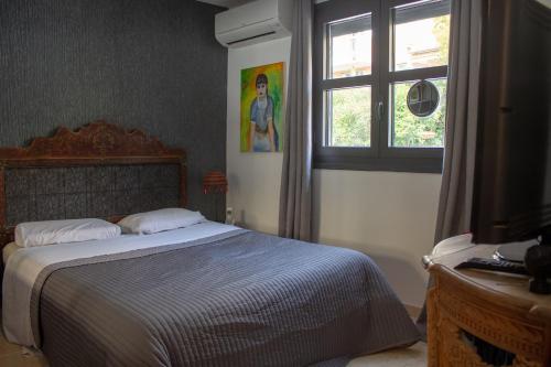 Postel nebo postele na pokoji v ubytování Le clos des Anges