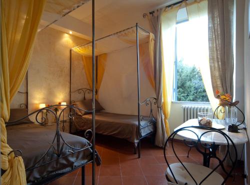 a bedroom with two beds and a window at Light of Rome in Rome