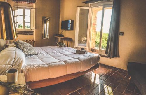 Säng eller sängar i ett rum på La Falconara