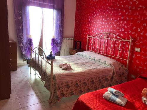 Postel nebo postele na pokoji v ubytování B&B Al Castello