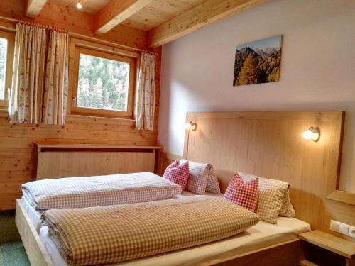 Postel nebo postele na pokoji v ubytování Landhaus Hubert Fiegl