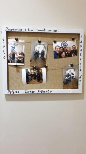 a picture frame with pictures of people on a wall at Boutique Hotel Palazzo Corso Umberto in Boiano