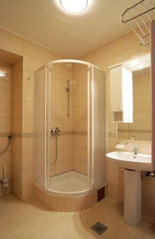 a bathroom with a shower and a sink at Hostel Rakitje-Rakitje in Rakitje