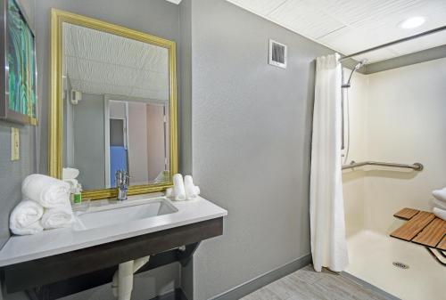 a bathroom with a sink and a mirror at Holiday Inn - Memphis Downtown - Beale St., an IHG Hotel in Memphis