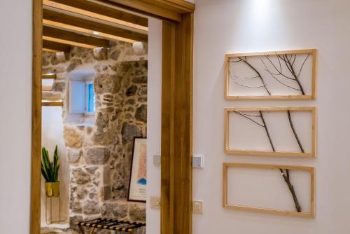 a room with two windows with branches on the wall at Apartment Harmony in Dubrovnik