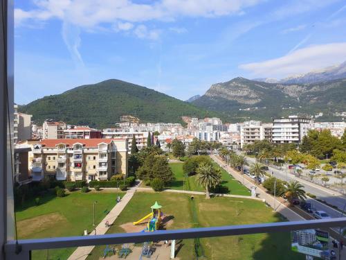 a view of a city from a window at Apartments Menuet in Budva