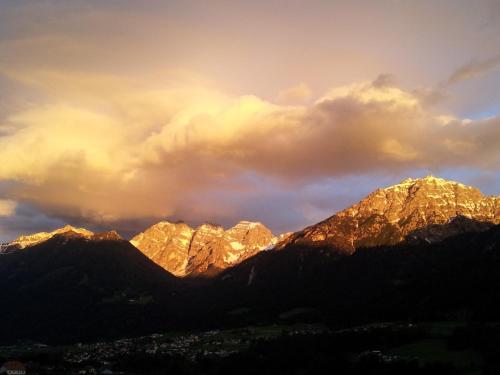 a view of the mountains at sunset at Haus Hubertus in Mieders