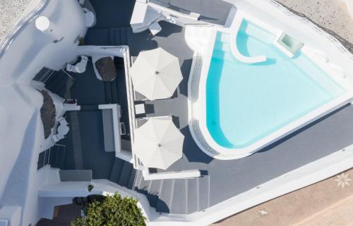 an overhead view of a swimming pool on a yacht at White Concept Caves in Fira