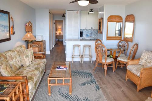 a living room with a couch and a table at Maui Vista 1313 in Kihei