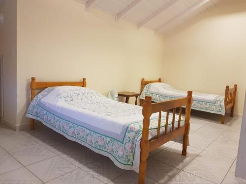 Un pat sau paturi într-o cameră la Casa de praia