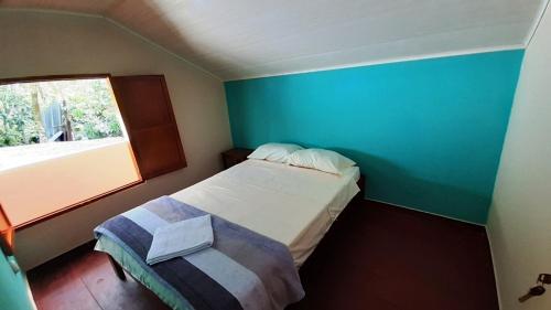 Postel nebo postele na pokoji v ubytování Los Balcones Hostal - Caliyaco
