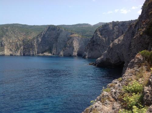 a large body of water between two rocky cliffs at Evangelia in Ayia Evfimia