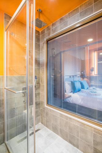 a shower with a glass door in a bathroom at Signature Ortahisar Hotel & SPA in Ürgüp