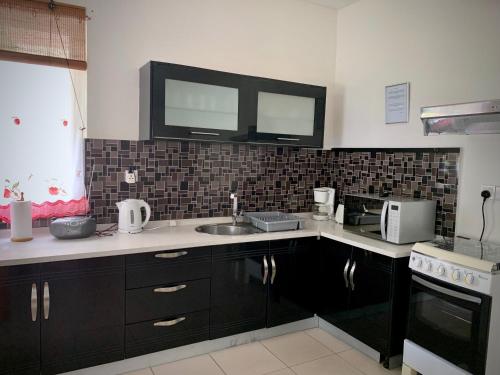 Dapur atau dapur kecil di Villa Oliveraie Apartments