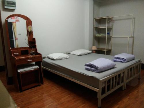 Ένα ή περισσότερα κρεβάτια σε δωμάτιο στο We home