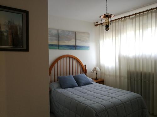 Postel nebo postele na pokoji v ubytování Atico en Biescas con Piscina, Tenis y Barbacoa