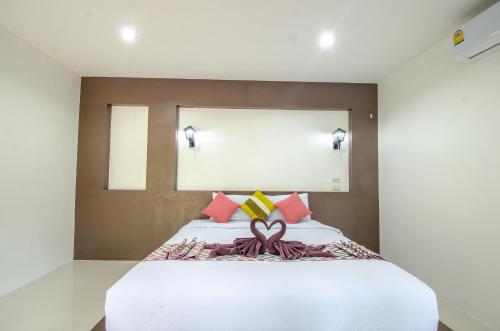 Postel nebo postele na pokoji v ubytování Khum Maikaew Resort