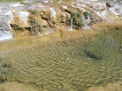 a stream of water coming out of a waterfall at Hotel Rural Curia in El Castellar
