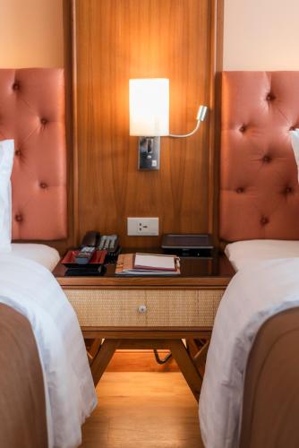 Letto o letti in una camera di The Empress Premier Chiang Mai