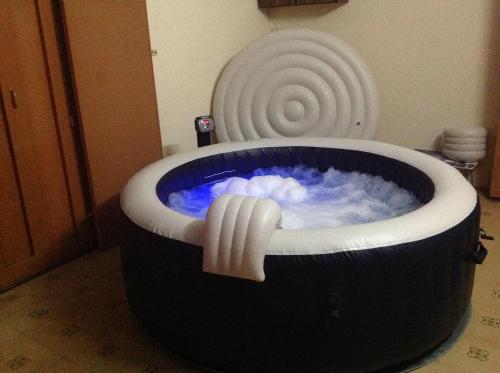 a jacuzzi tub in a room with a spiral at Luxor Residence Guesthouse in Belle Mare