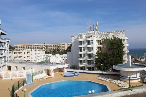 a large swimming pool on top of a building at Naturmar Praia in Albufeira