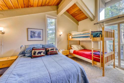 a bedroom with a bed and bunk beds in a room at Chamonix 85 in Mammoth Lakes