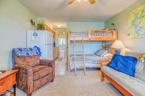 a living room with a bunk bed and a chair at Moosehead Condo Unit #5 in Rockwood